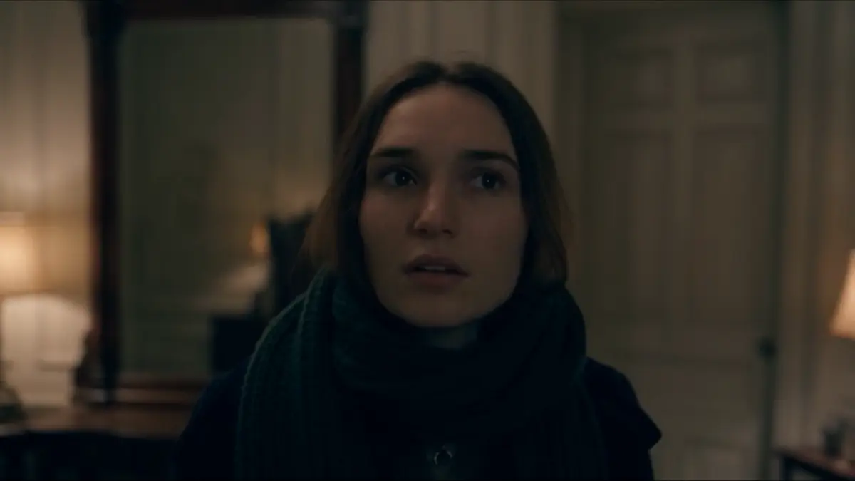A girl in a scarf, startled